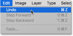 Choosing the Undo command under the Edit menu.