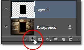 Mengklik ikon Layer Styles di panel Layers di Photoshop. Image © 2012 Photoshop Essentials.com