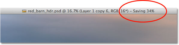The save progress indicator at the top of the document window in Photoshop CS6. Image © 2012 Steve Patterson, Photoshop Essentials.com