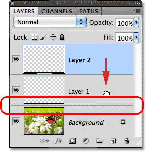 Dragging Layer 2 below Layer 1. Image © 2011 Photoshop Essentials.com