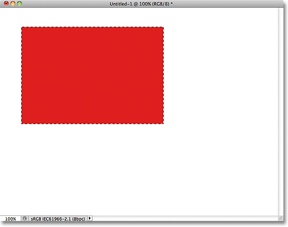 The selection has been filled with red. Image © 2011 Photoshop Essentials.com