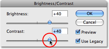Перемещение регулятора Контрастность яркости диалоговое окно / Contrast. Image © 2009 Photoshop Essentials.com