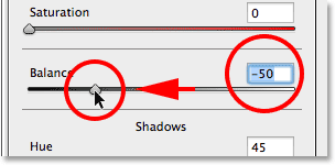 Dragging the Balance slider towards the left. Image © 2014 Photoshop Essentials.com