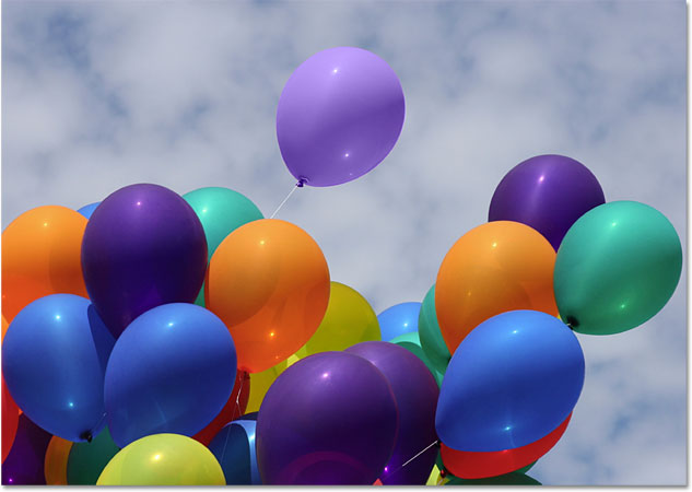 The orange balloon is now a light purple balloon. Image © 2010 Photoshop Essentials.com