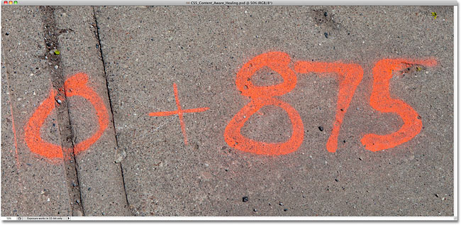 A photo of numbers spray painted on a sidewalk. Image © 2010 Steve Patterson, Photoshop Essentials.com