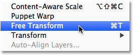 Selecting the Free Transform command from the Edit menu. Image © 2012 Photoshop Essentials.com