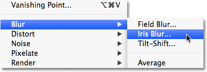 Memilih Iris Blur dari menu Filter di Photoshop CS6. Image © 2012 Photoshop Essentials.com