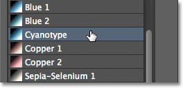 Selecting the Cyanotyoe Photographic Toning preset. Image © 2012 Photoshop Essentials.com