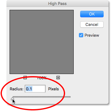 Setting the Radius option in the High Pass filter to its lowest value. Image © 2016 Photoshop Essentials.com