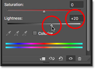 Dragging the Lightness slider to brighten the teeth.