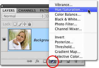 Memilih Hue / Saturasi penyesuaian lapisan di Photoshop. Image © 2010 Photoshop Essentials.com