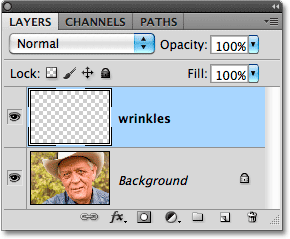 A new layer named 'wrinkles' appears in the Layers panel. Image © 2010 Photoshop Essentials.com