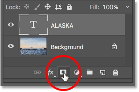Adding a layer mask to the Type layer in Photoshop. Image © 2016 Photoshop Essentials.com