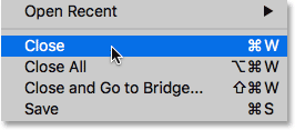 Choosing the Close command under the File menu in Photoshop CC. Image © 2016 Photoshop Essentials.com