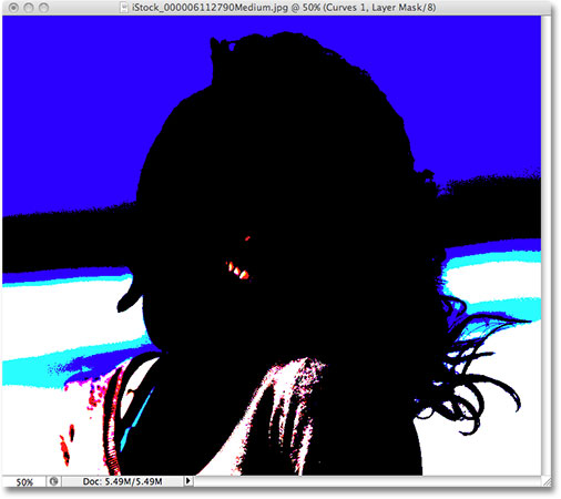 Перемещение точки белого ползунка с шоу Clipping включен в Photoshop CS3. Image © 2009 Photoshop Essentials.com.