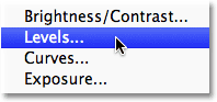 Choosing a Levels adjustment layer icon in the Layers panel in Photoshop. Image © 2011 Photoshop Essentials.com