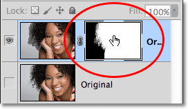 Clicking on the layer mask thumbnail in the Layers panel. Image © 2012 Photoshop Essentials.com