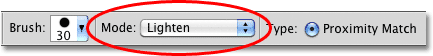 Changing the Brush Mode for the Spot Healing Brush from Normal to Lighten. Image © 2010 Photoshop Essentials.com