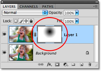 The radial gradient is visible in the layer mask thumbnail in the Layers panel. Image © 2008 Photoshop Essentials.com.