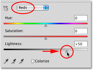 Menyeret slider Lightness di Hue / Saturasi kotak dialog di Photoshop. Image © 2010 Photoshop Essentials.com