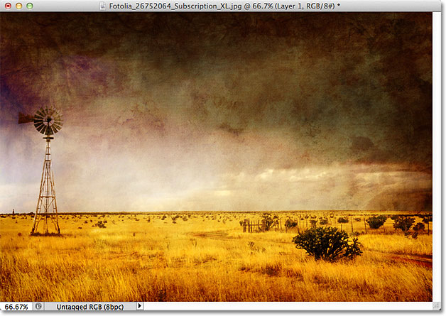 Efek dengan lapisan tekstur diatur ke modus campuran Overlay. Gambar © 2011 Photoshop Essentials.com.