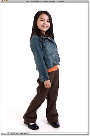 A selection outline appears around the girl in the photo. Image © 2010 Photoshop Essentials.com.