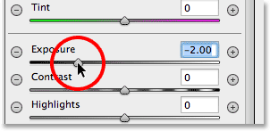 Setting the Radial Filter Exposure value to -2.00. Image © 2013 Photoshop Essentials.com