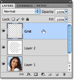 Memilih lapisan Grid di panel Layers. Gambar © 2011 Photoshop Essentials.com.