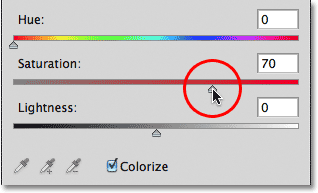 Increasing the Saturation level for red to 70. Image © 2011 Photoshop Essentials.com.