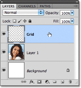 Memilih lapisan Grid di panel Layers. Gambar © 2011 Photoshop Essentials.com.