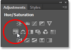 Memilih Hue / Saturasi penyesuaian lapisan dari panel Penyesuaian. Image © 2013 Photoshop Essentials.com