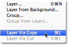 Memilih New Layer via Copy perintah dari menu Layer. Image © 2012 Photoshop Essentials.com