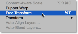 Selecting Free Transform from under the Edit menu. Image © 2014 Photoshop Essentials.com.