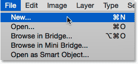 Selecting the New command from under the File menu. Image © 2014 Photoshop Essentials.com.
