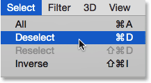 Choosing Deselect from under the Select menu. Image © 2014 Photoshop Essentials.com.