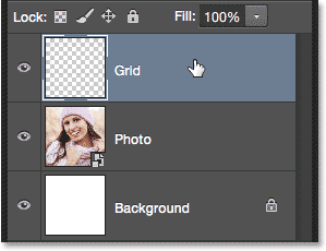 Selecting the Grid layer in the Layers panel. Image © 2014 Photoshop Essentials.com.