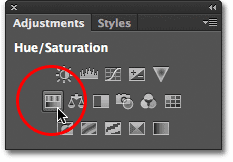 Memilih Hue / Saturasi dari panel Penyesuaian. Image © 2012 Photoshop Essentials.com