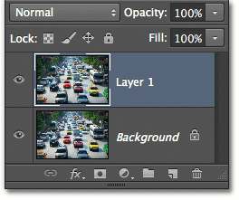 Layer 1 muncul di atas layer Background. Image © 2012 Photoshop Essentials.com