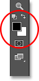 The Foreground and Background color swatches in the Tools panel. Image © 2013 Photoshop Essentials.com