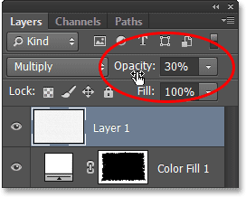 Menurunkan opacity layer. Image © 2013 Photoshop Essentials.com