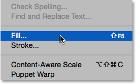 Selecting the Fill command from under the Edit menu. Image © 2014 Photoshop Essentials.com.