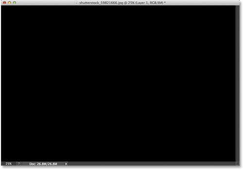 Dokumen setelah mengisi lapisan baru dengan hitam. Image © 2013 Photoshop Essentials.com