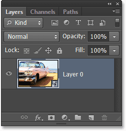 Panel Layers menampilkan Smart Object. Image © 2013 Photoshop Essentials.com