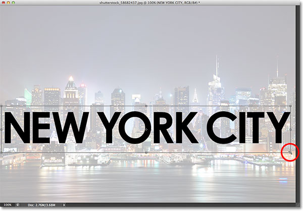 Resizing and moving the text with the Free Transform command. Image © 2013 Photoshop Essentials.com.