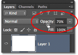 Menurunkan nilai opacity untuk Layer 1. Image © 2013 Photoshop Essentials.com.