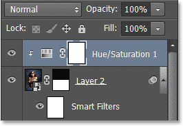 Panel Layers menampilkan yang Hue baru / lapisan penyesuaian Saturasi. Image © 2013 Photoshop Essentials.com