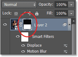 Panel Layers menampilkan thumbnail layer mask. Image © 2013 Photoshop Essentials.com