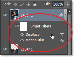 Kedua Smart Filter tercantum di bawah ini lapisan dalam panel Layers. Image © 2013 Photoshop Essentials.com