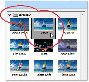 Memilih filter Cutout dari kategori Artistik di Galeri Filter. Image © 2013 Photoshop Essentials.com