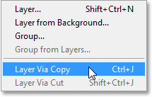 Memilih New Layer Via Copy perintah dari menu Layer dalam Photoshop CS6. Image © 2013 Photoshop Essentials.com